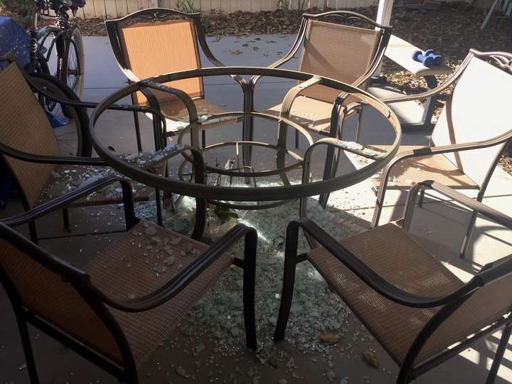 Shattered glass under a table base